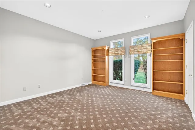 a view of an empty room with a empty shelves