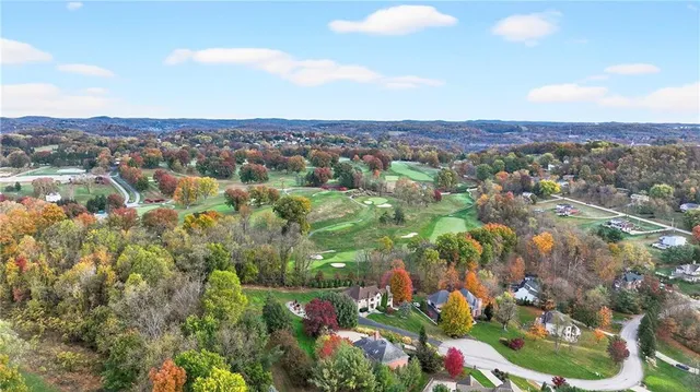 an aerial view of residential house and outdoor space