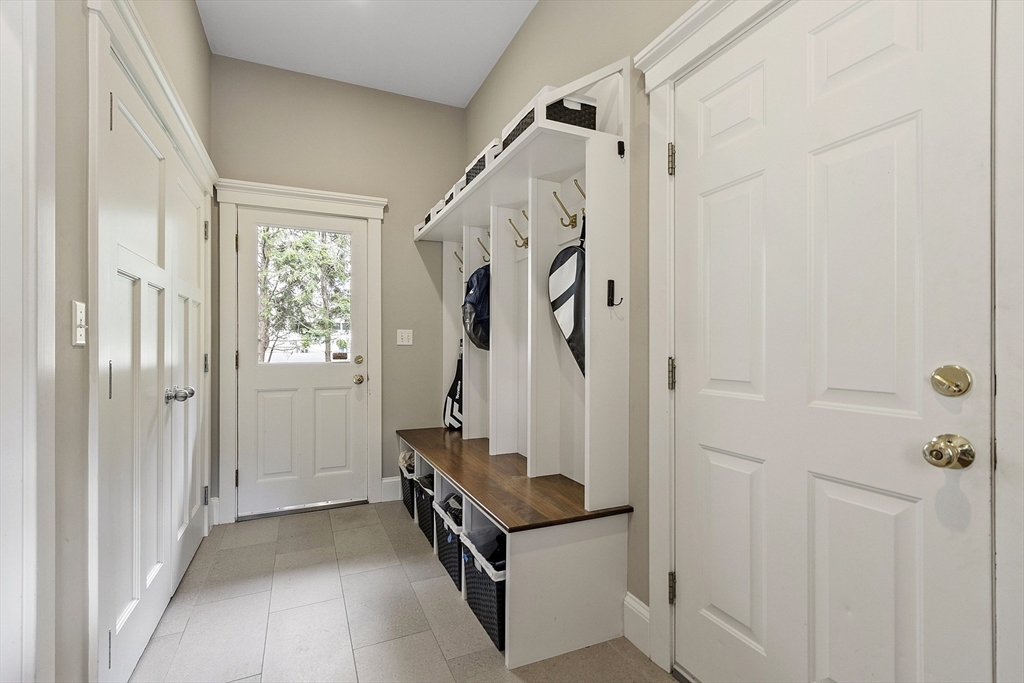 121 Concord Avenue Lexington, MA 02421 - Photo 15 of 42 a view of a entryway with wooden walls