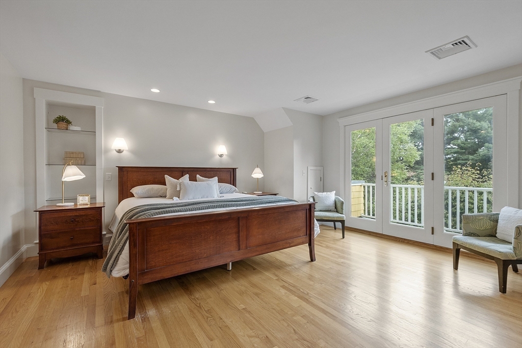 121 Concord Avenue Lexington, MA 02421 - Photo 16 of 42 a bedroom with a bed and a large window