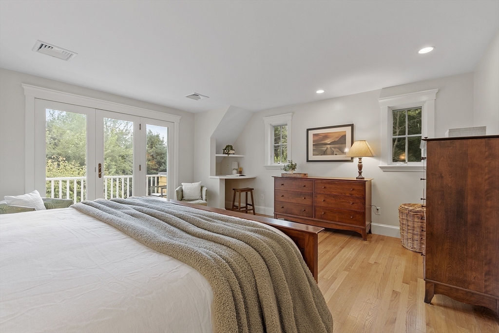 121 Concord Avenue Lexington, MA 02421 - Photo 17 of 42 a bedroom with a bed and a large window