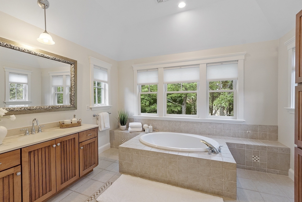 121 Concord Avenue Lexington, MA 02421 - Photo 18 of 42 a spacious bathroom with a tub sink and mirror