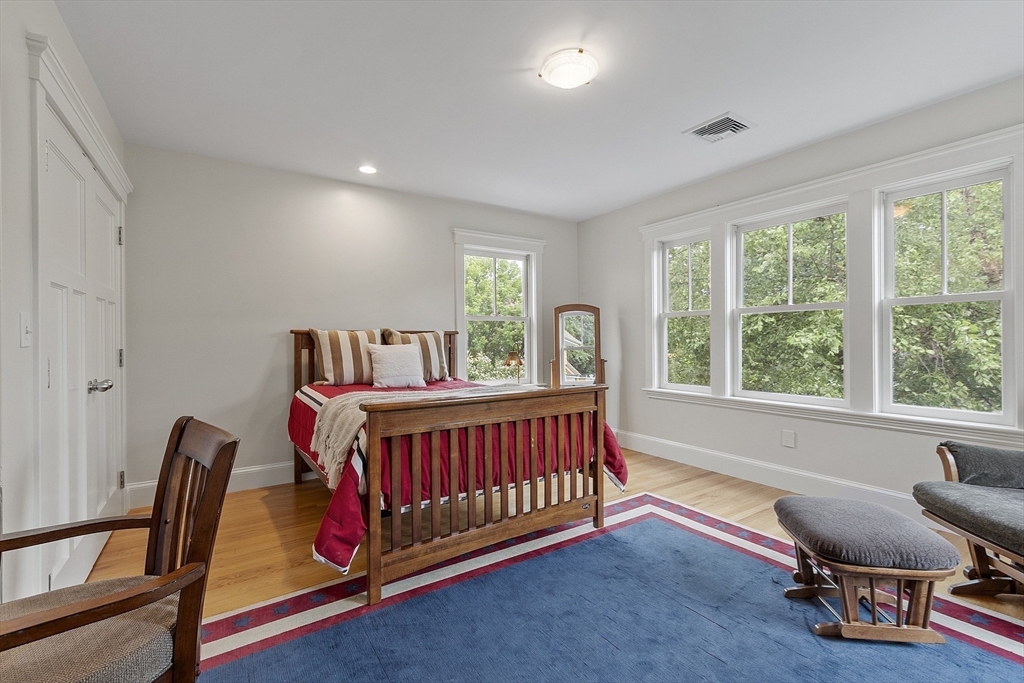 121 Concord Avenue Lexington, MA 02421 - Photo 20 of 42 a bedroom with furniture and a window
