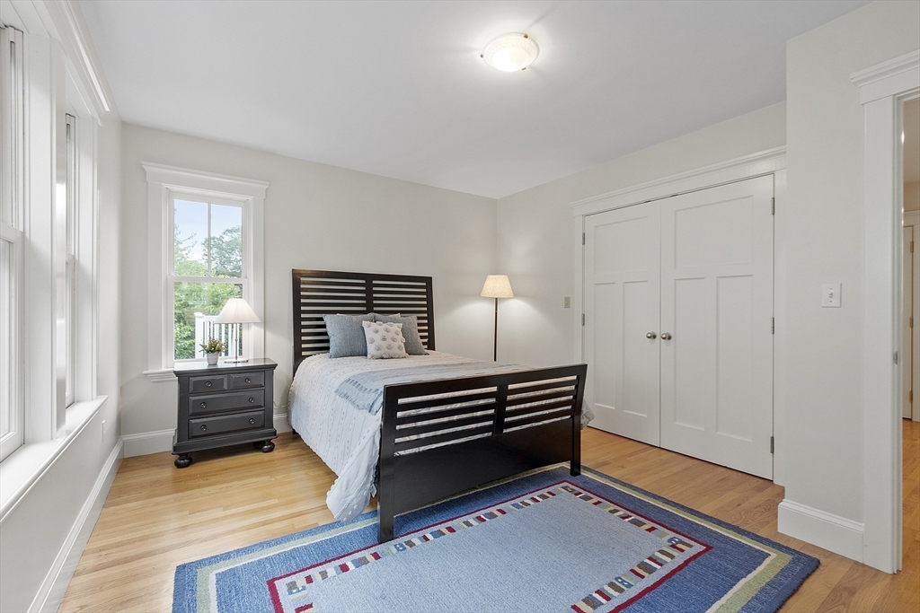 121 Concord Avenue Lexington, MA 02421 - Photo 22 of 42 a bed room with a bed and a window