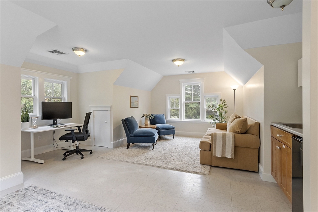 121 Concord Avenue Lexington, MA 02421 - Photo 29 of 42 a living room with furniture and a flat screen tv