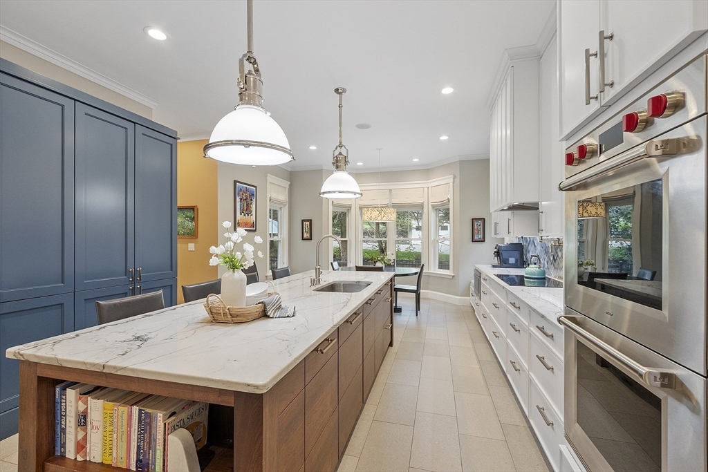 121 Concord Avenue Lexington, MA 02421 - Photo 3 of 42 a large kitchen with stainless steel appliances granite countertop a lot of counter space