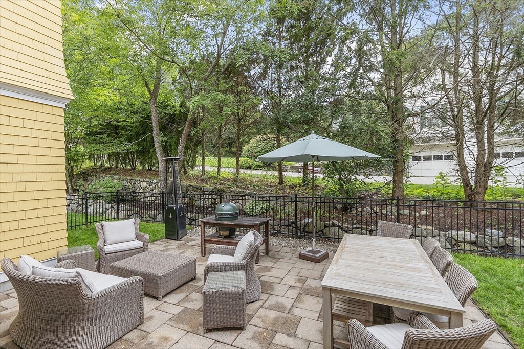 121 Concord Avenue Lexington, MA 02421 - Photo 35 of 42 a view of backyard with outdoor seating a patio and plants