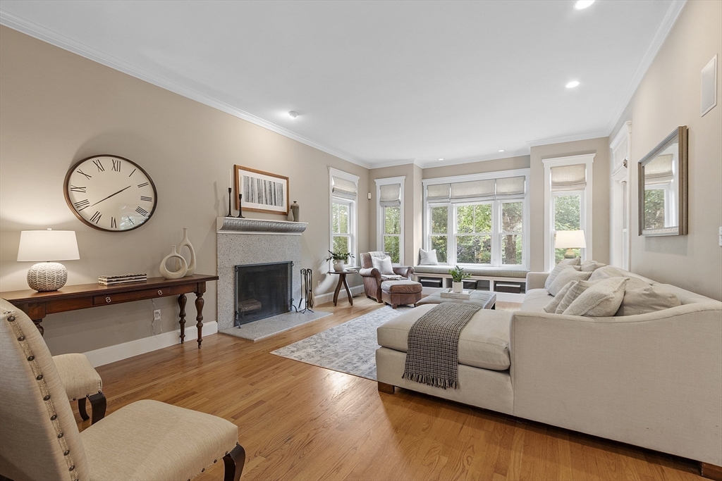 121 Concord Avenue Lexington, MA 02421 - Photo 7 of 42 a living room with furniture and a fireplace
