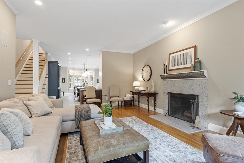 121 Concord Avenue Lexington, MA 02421 - Photo 8 of 42 a living room with furniture and a fireplace