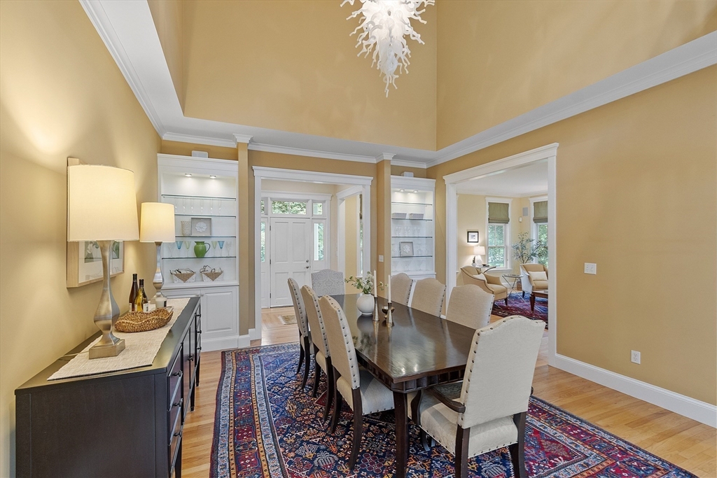 121 Concord Avenue Lexington, MA 02421 - Photo 10 of 42 a view of a dining room with furniture wooden floor and chandelier