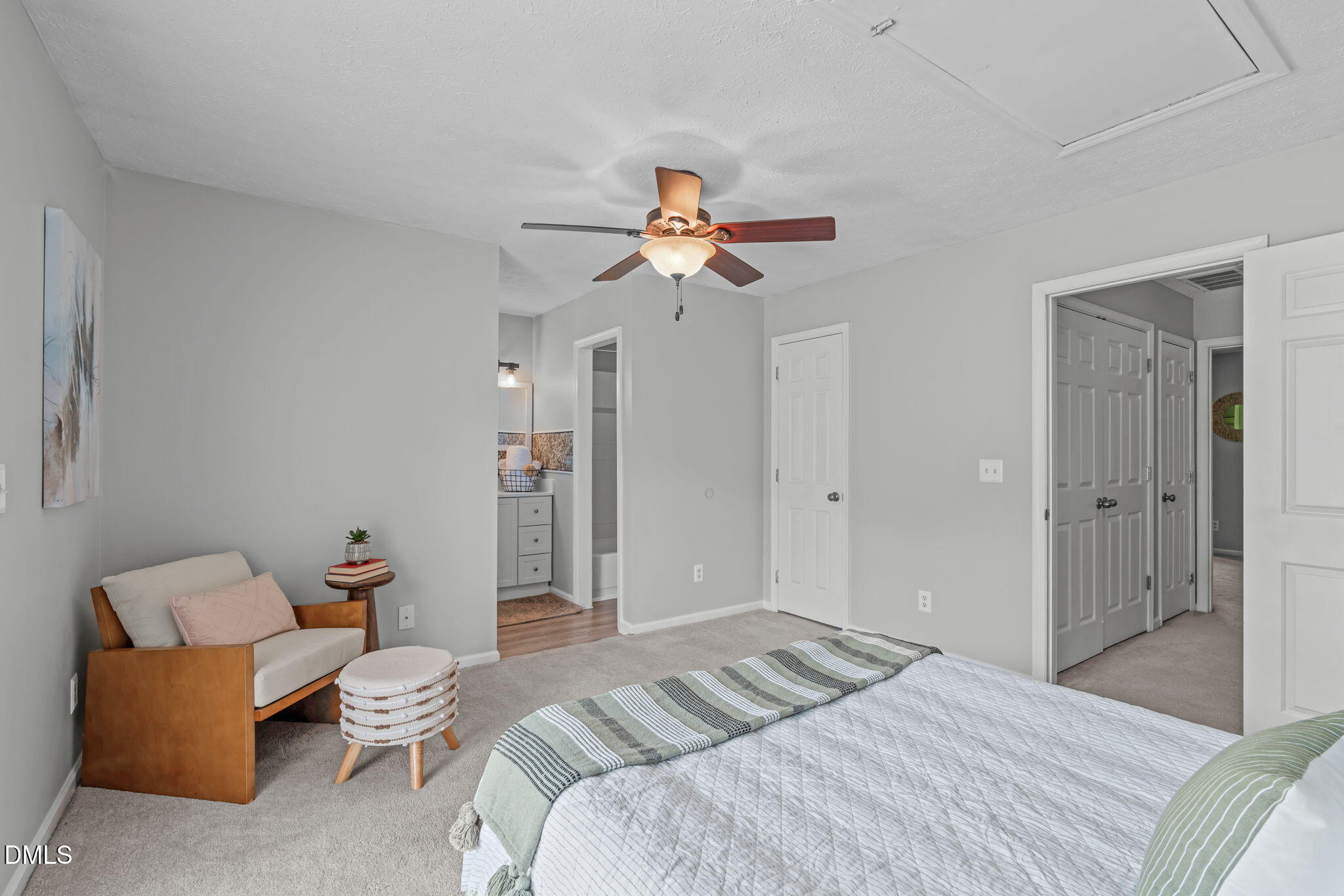 203 Oak Hollow Court Raleigh, NC 27613 - Photo 27 of 37 a bedroom with a bed and a chandelier
