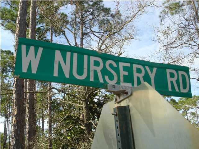 15 East Nursery Road Santa Rosa Beach, FL 32459 - Photo 1 of 3 a view of sign board with street and trees
