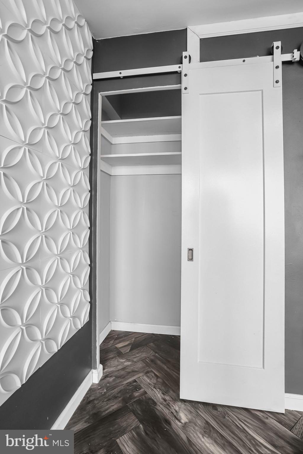 922 24th Street Northwest, Unit 301 Washington, DC 20037 - Photo 33 of 40 a view of walk in closet with wooden floor