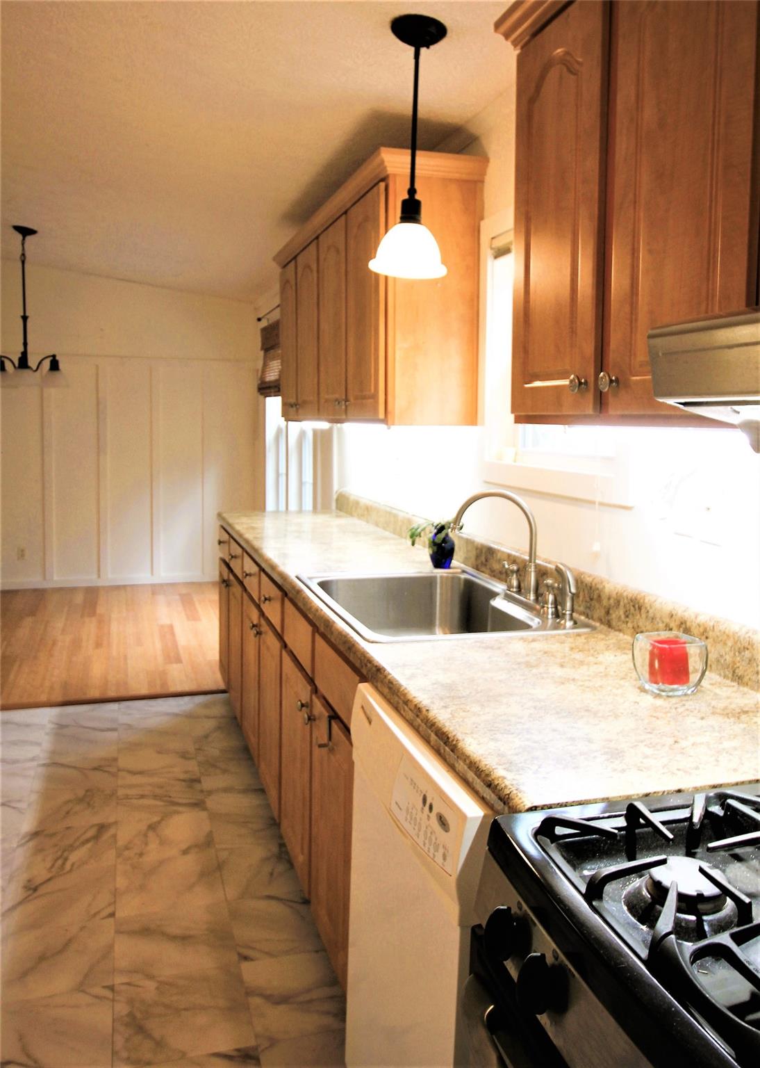 2 Whisper Street Clyde, NC 28721 - Photo 13 of 44 a kitchen with a sink stove and cabinets