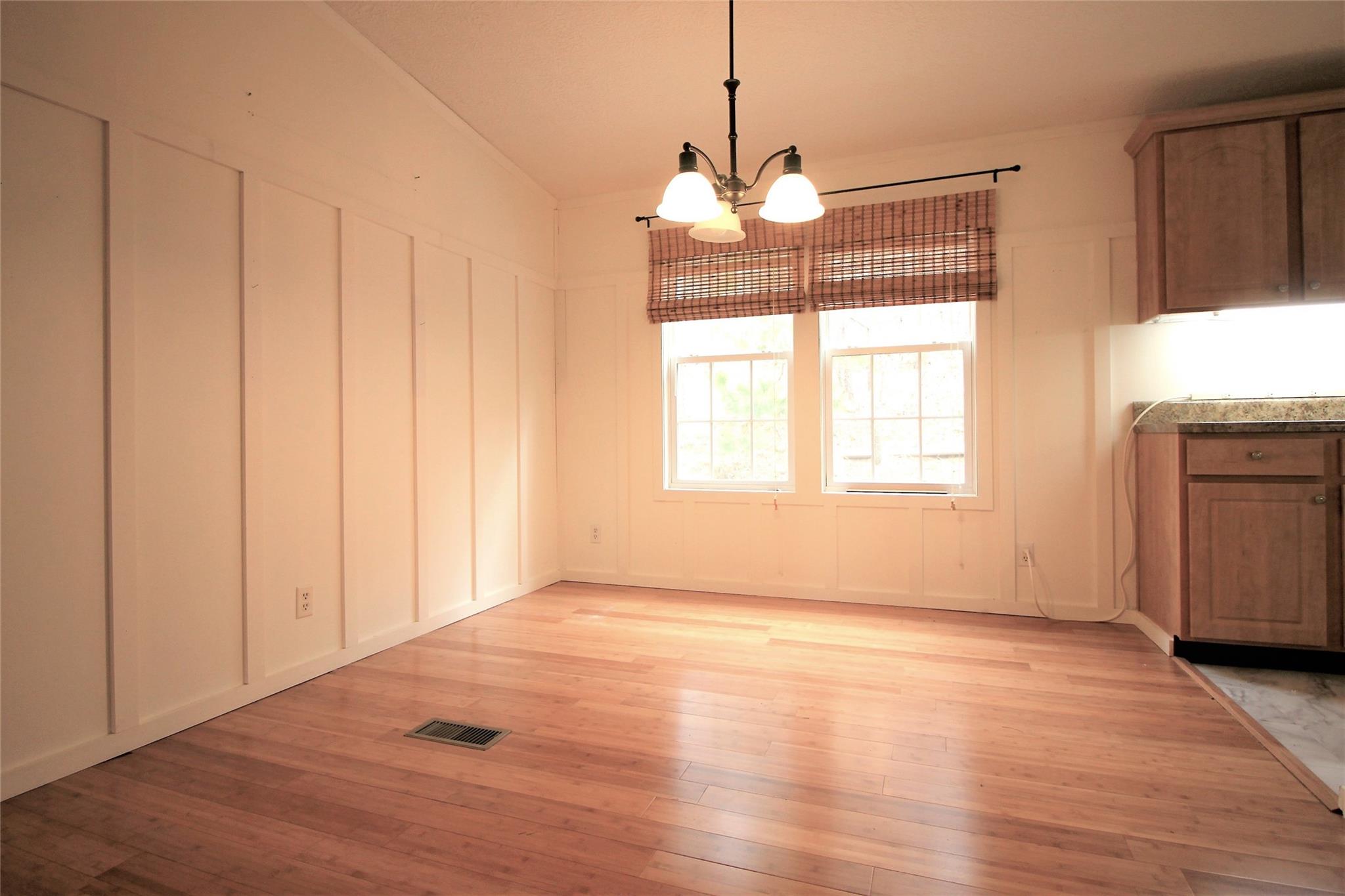 2 Whisper Street Clyde, NC 28721 - Photo 15 of 44 a view of empty room with wooden floor and fan