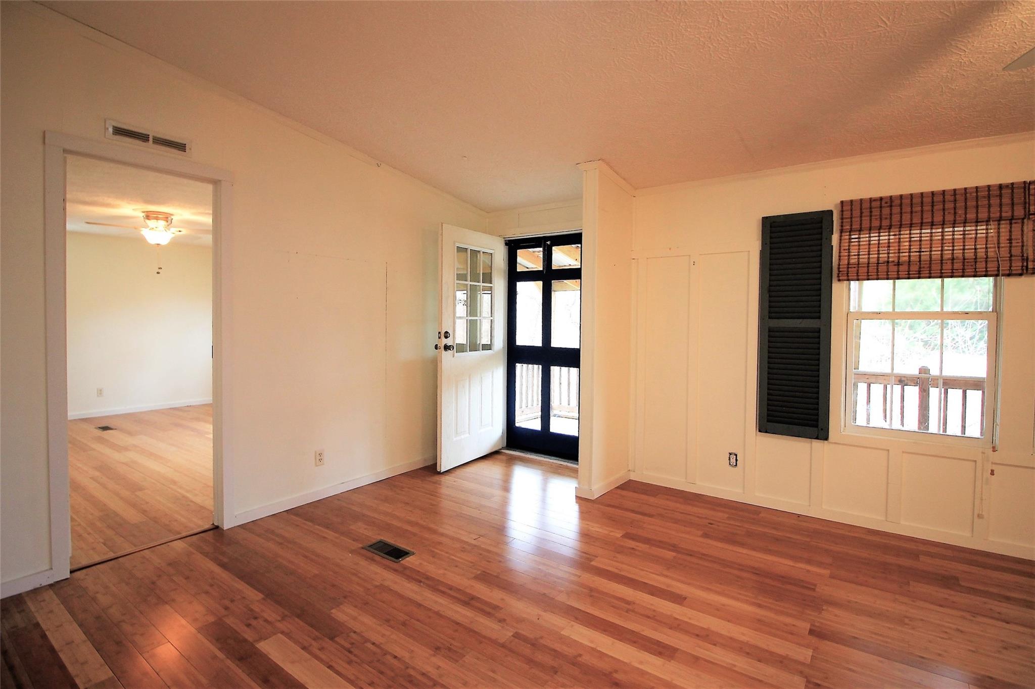 2 Whisper Street Clyde, NC 28721 - Photo 18 of 44 wooden floor in an empty room with a window