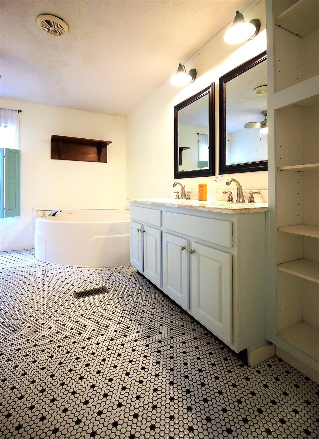 2 Whisper Street Clyde, NC 28721 - Photo 19 of 44 a bathroom with a sink a toilet and mirror