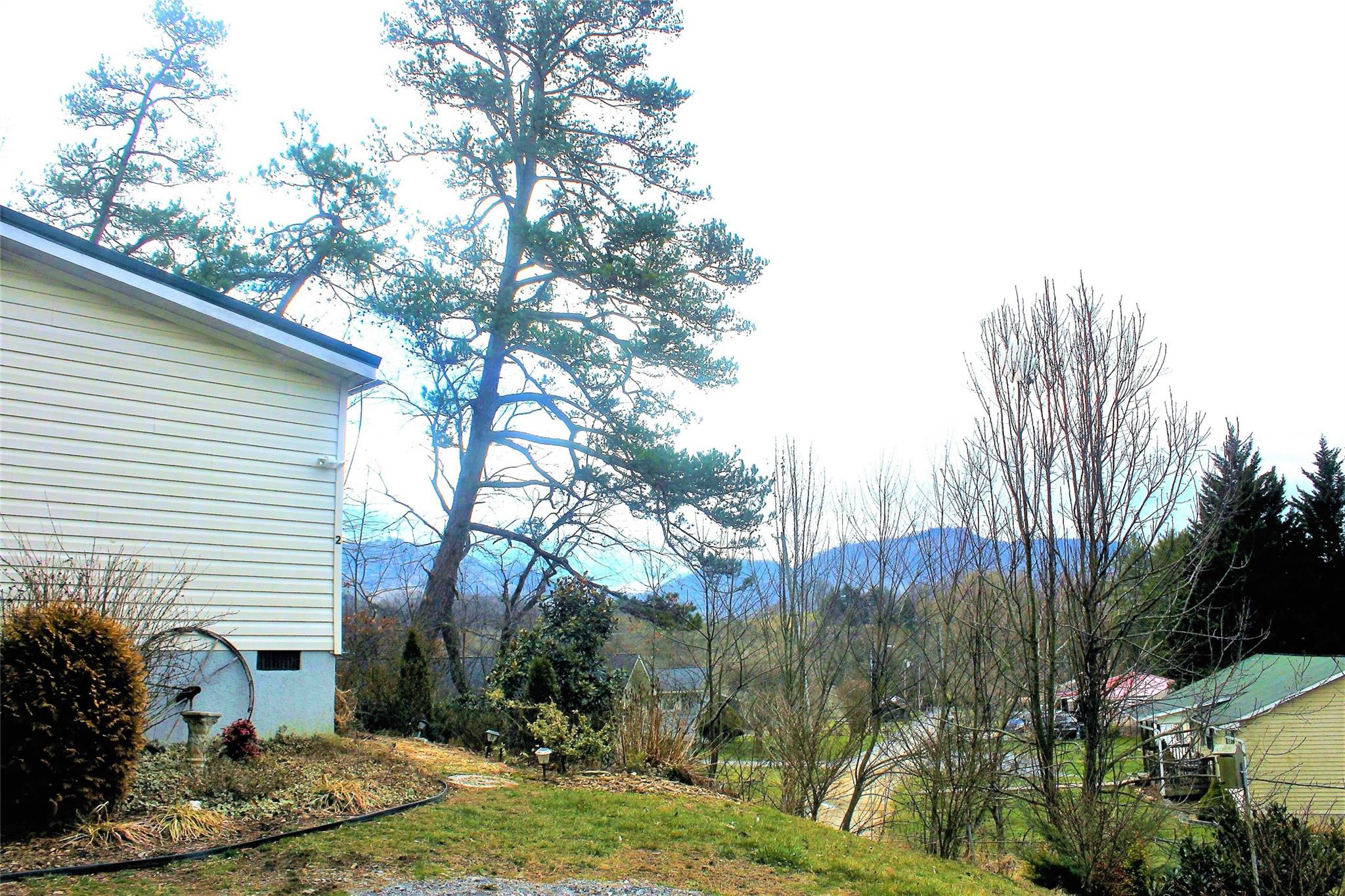 2 Whisper Street Clyde, NC 28721 - Photo 2 of 44 a view of a house with a yard