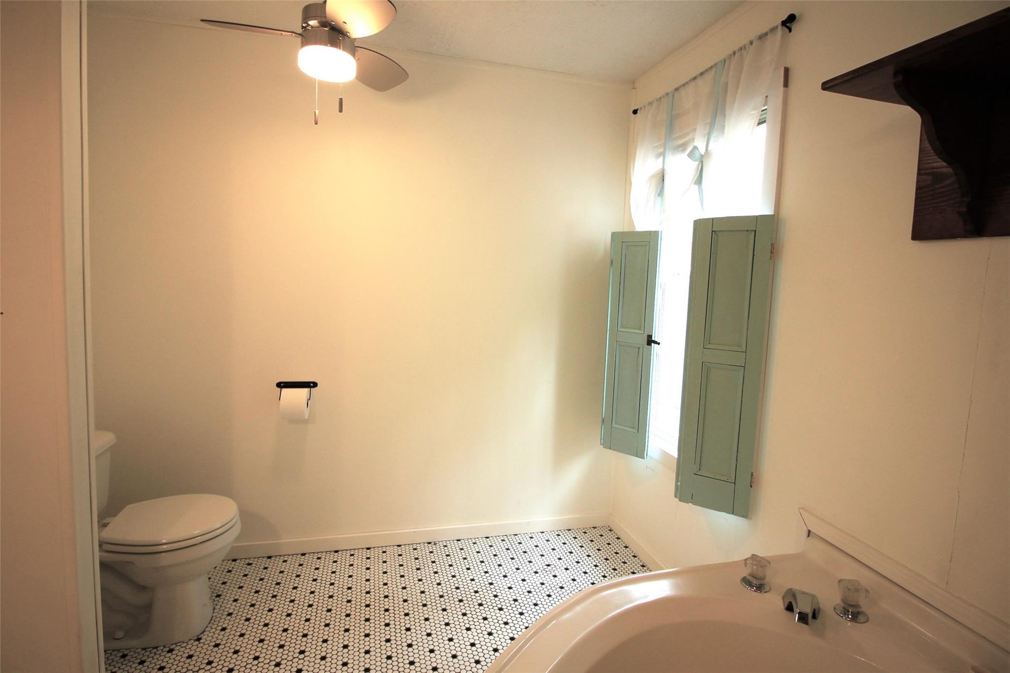 2 Whisper Street Clyde, NC 28721 - Photo 25 of 44 a bathroom with a sink toilet and shower
