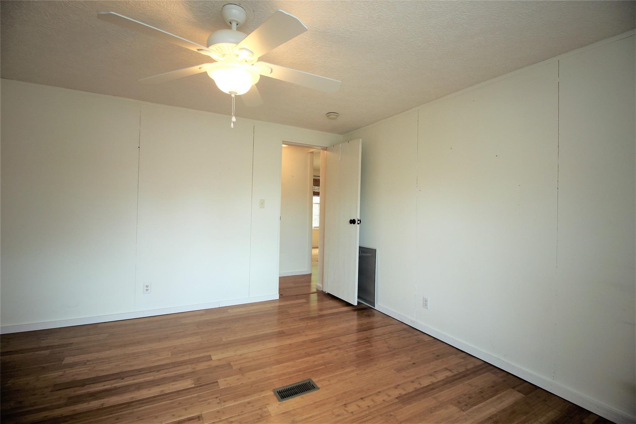 2 Whisper Street Clyde, NC 28721 - Photo 29 of 44 a view of an empty room with wooden floor