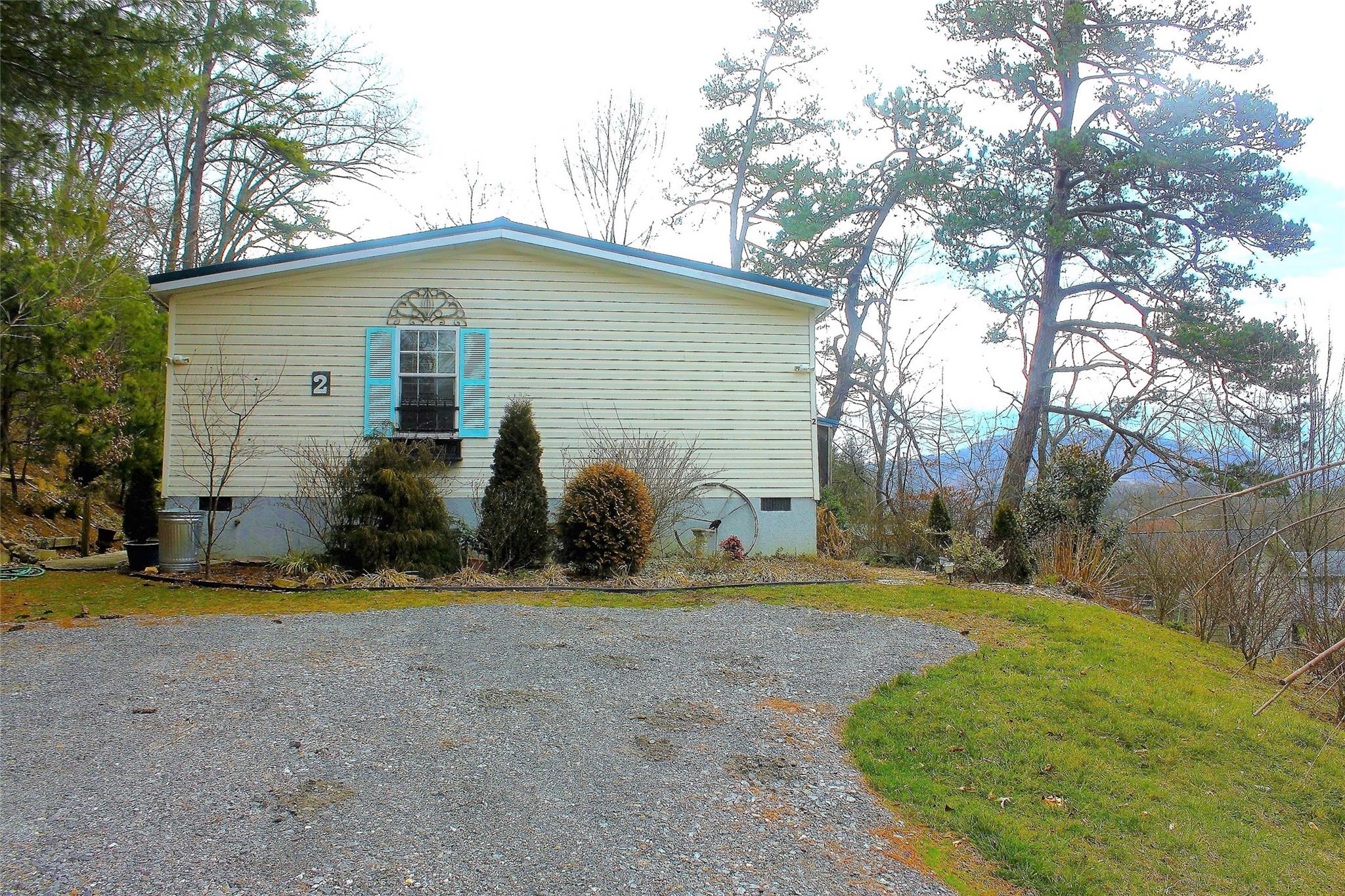 2 Whisper Street Clyde, NC 28721 - Photo 3 of 44 a view of a house with backyard and trees