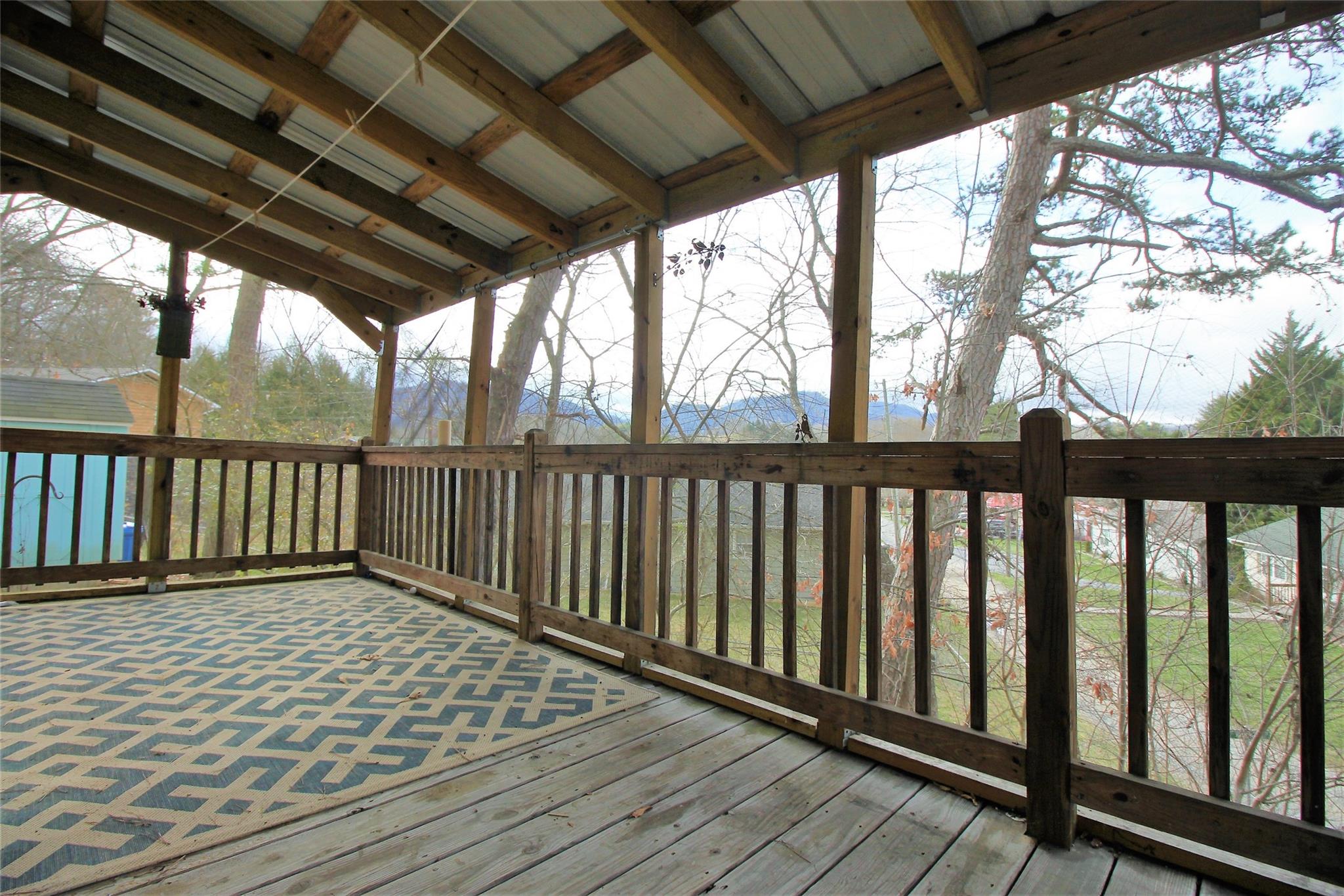 2 Whisper Street Clyde, NC 28721 - Photo 35 of 44 a view of porch with wooden floor