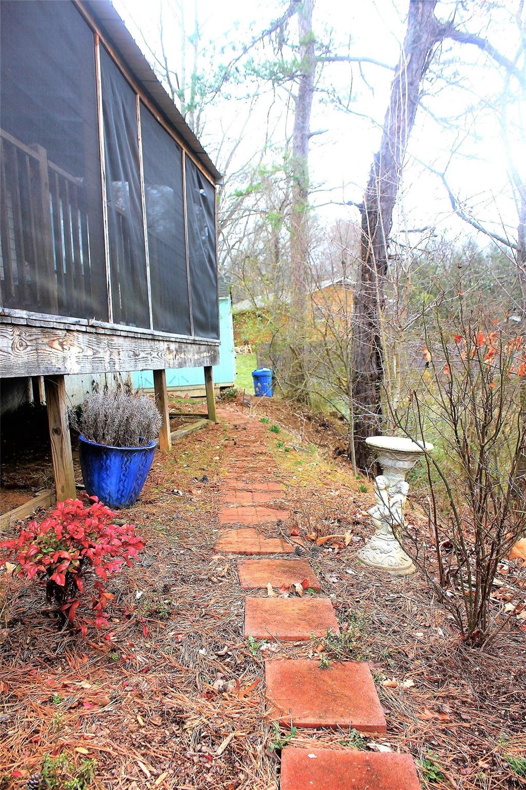 2 Whisper Street Clyde, NC 28721 - Photo 36 of 44 a view of a backyard with a sitting area