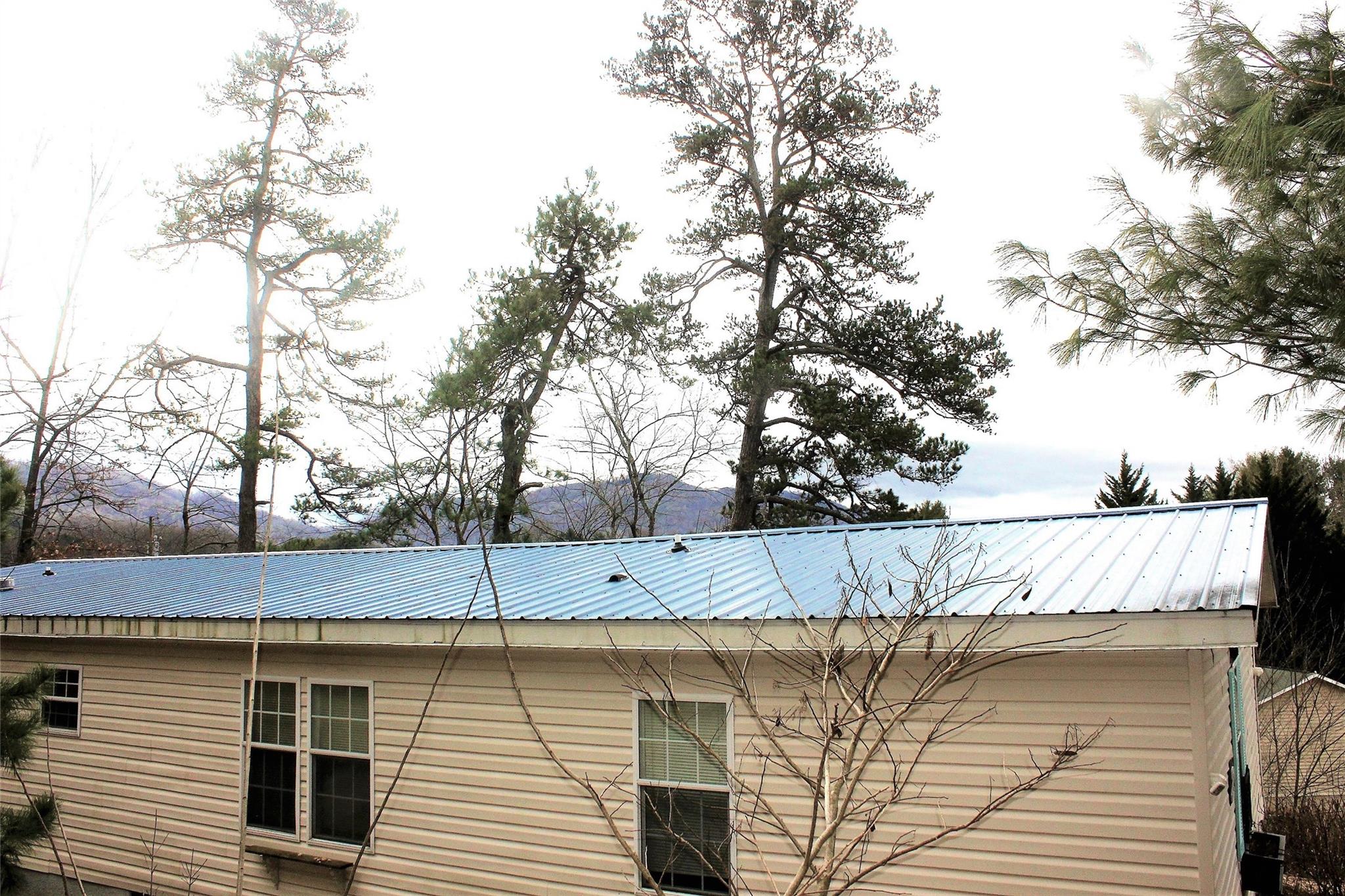 2 Whisper Street Clyde, NC 28721 - Photo 42 of 44 a view of a wooden deck and a lake view