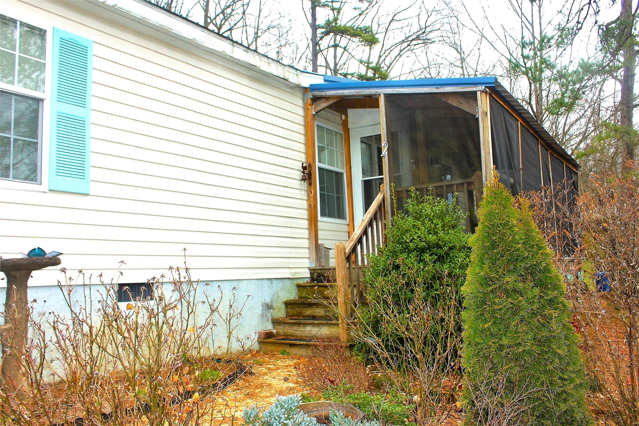 2 Whisper Street Clyde, NC 28721 - Photo 5 of 44 a yellow house with trees in front of it