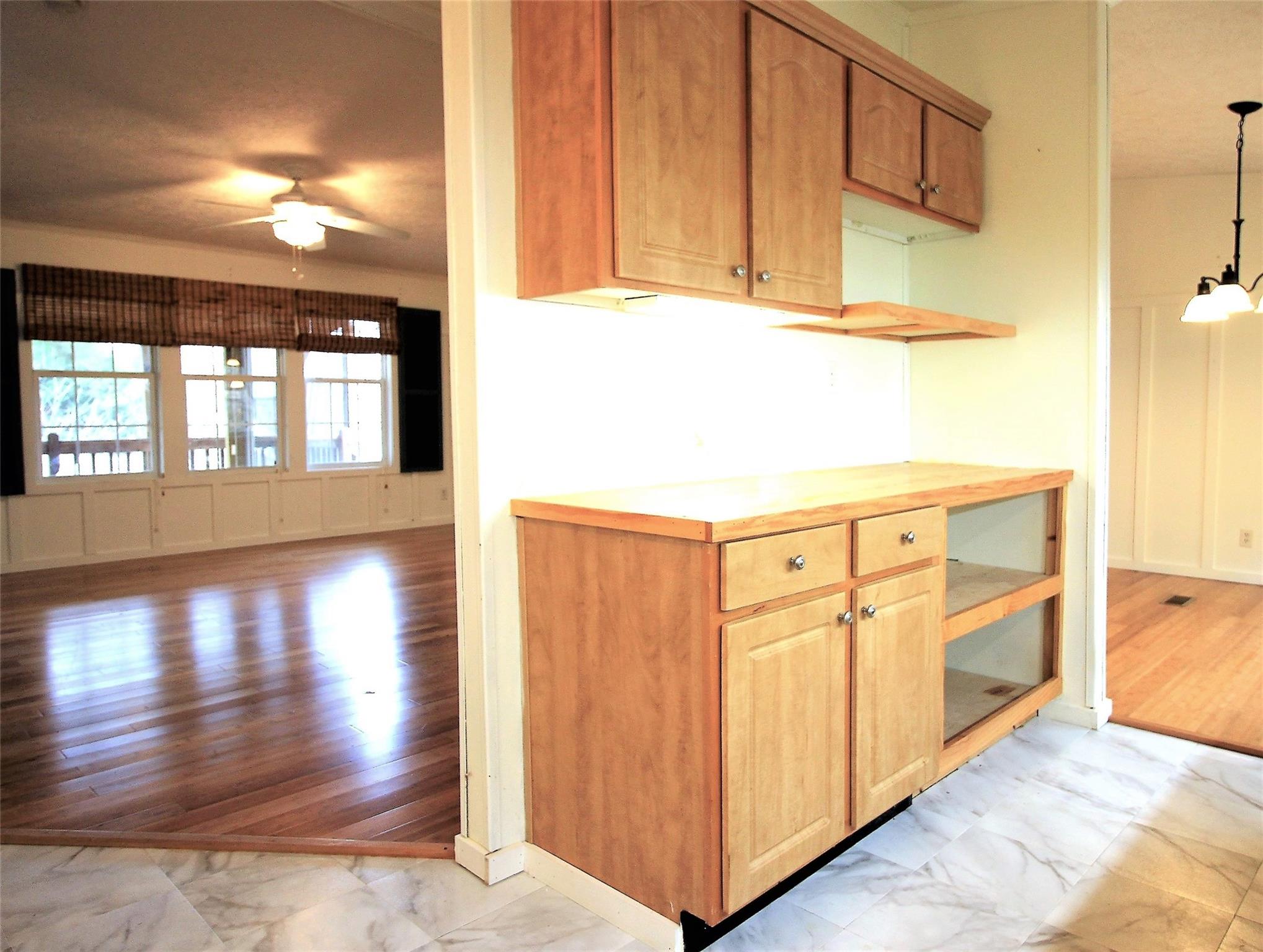 2 Whisper Street Clyde, NC 28721 - Photo 7 of 44 a view of a hallway with wooden floor and cabinet