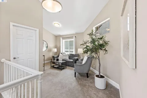 a bed room with a bed and a chair