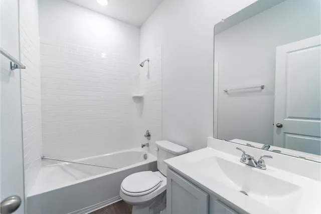 a bathroom with a sink toilet and a bathtub