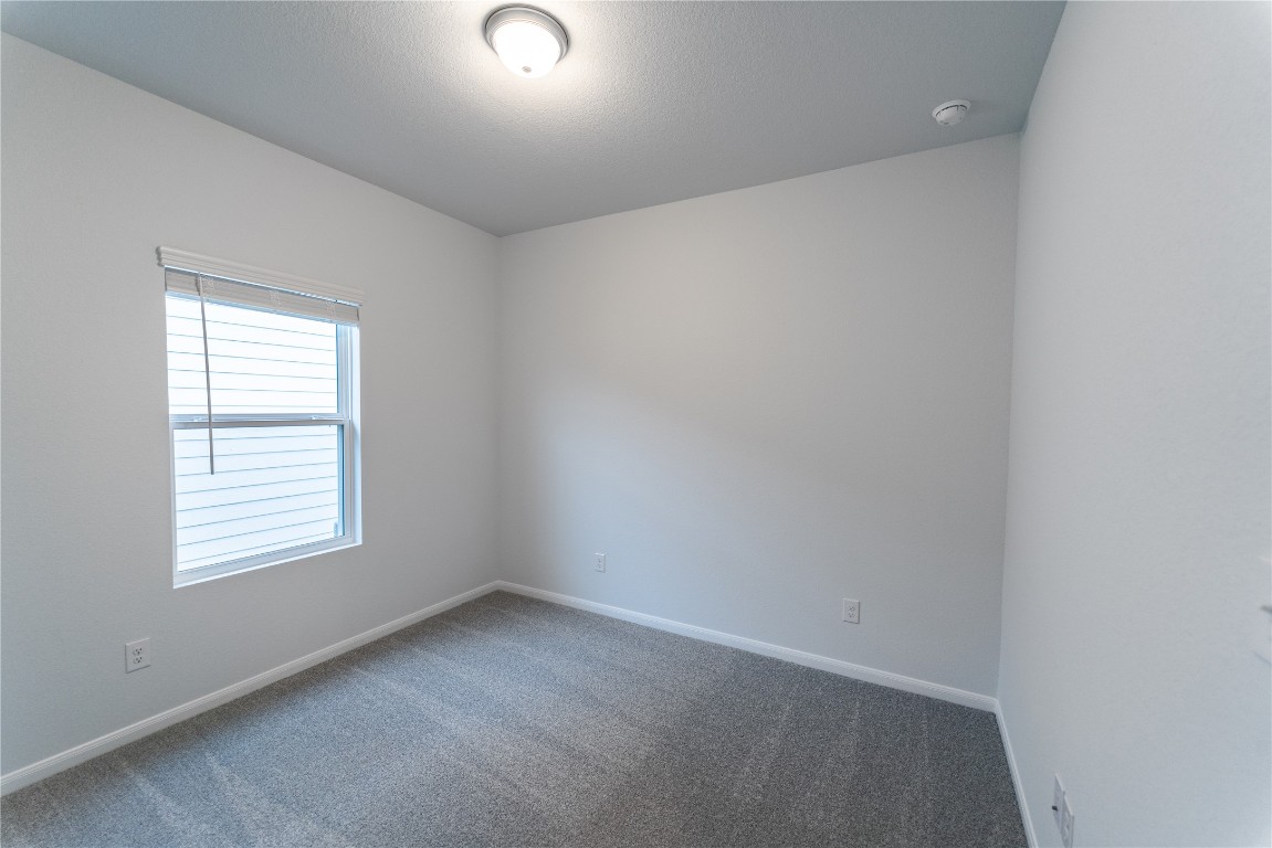 720 Barbary Coast Lane Jarrell, TX 76537 - Photo 15 of 19 an empty room with a window