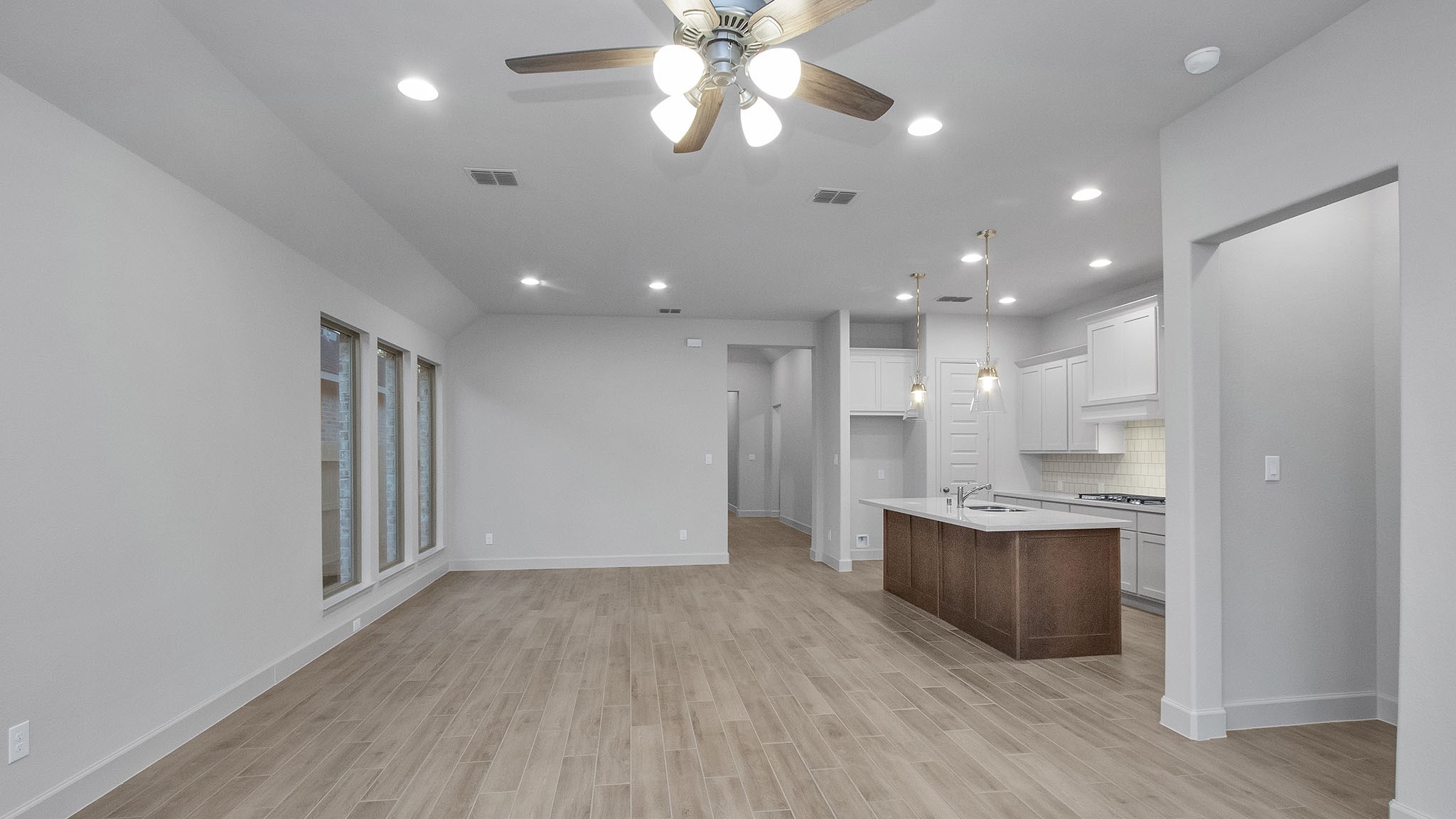 342 Prairie Warbler Street Magnolia, TX 77354 - Photo 4 of 24 a view of kitchen with cabinets and wooden floor