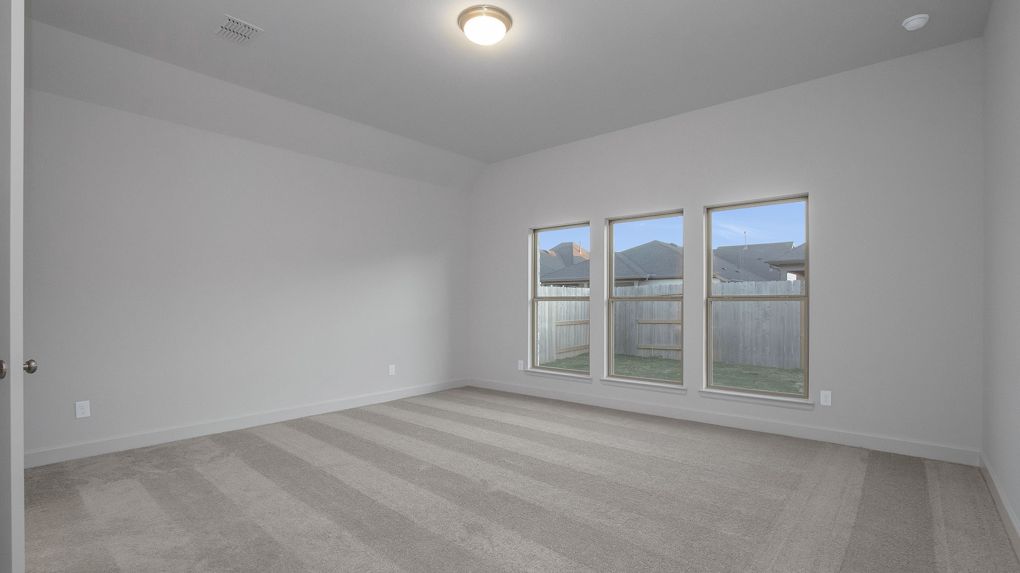 342 Prairie Warbler Street Magnolia, TX 77354 - Photo 6 of 24 an empty room with windows
