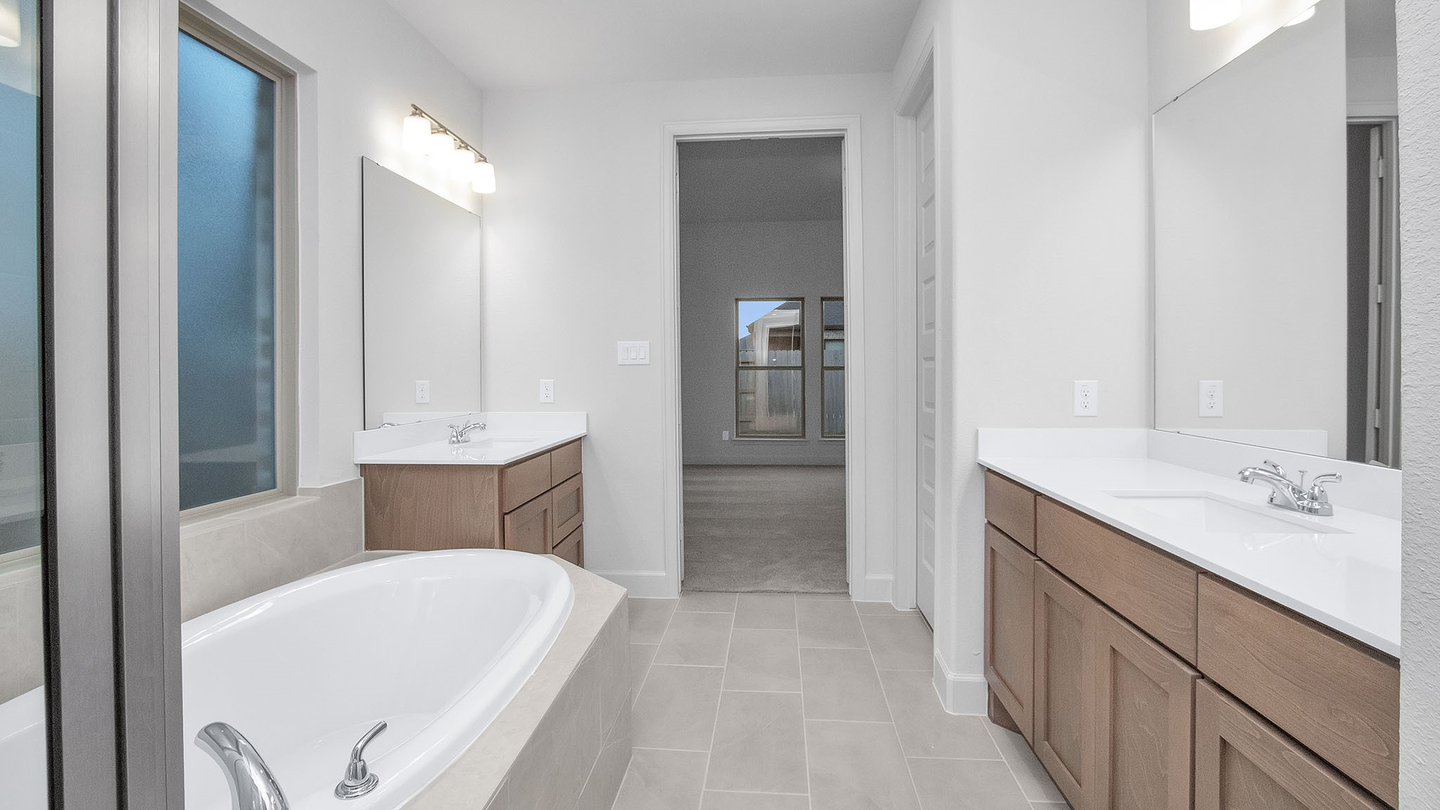 342 Prairie Warbler Street Magnolia, TX 77354 - Photo 7 of 24 a en suite bathroom with a tub sink and mirror