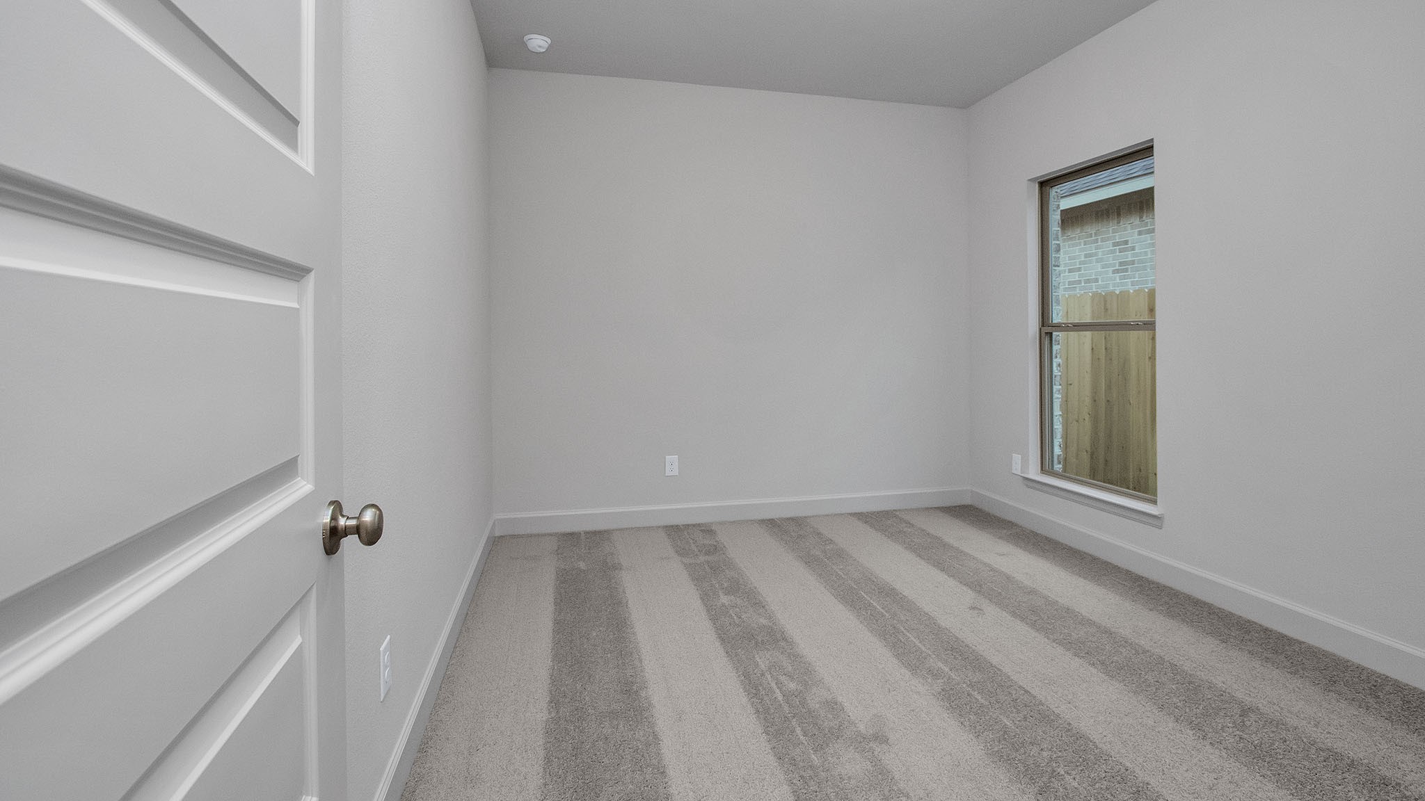 342 Prairie Warbler Street Magnolia, TX 77354 - Photo 9 of 24 a view of an empty room with a window