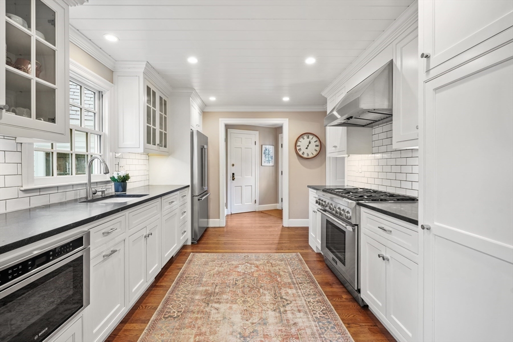 21 Alden Road Wellesley, MA 02481 - Photo 11 of 36 a large kitchen with stainless steel appliances granite countertop a stove and a sink