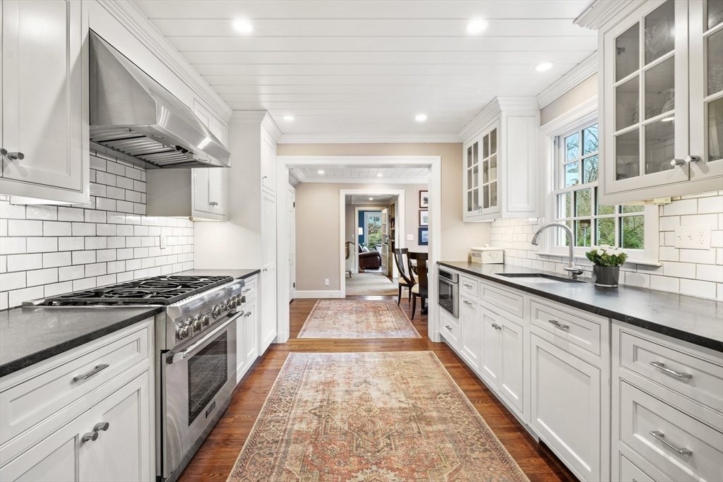 21 Alden Road Wellesley, MA 02481 - Photo 12 of 36 a large kitchen with stainless steel appliances granite countertop a lot of counter space and a sink