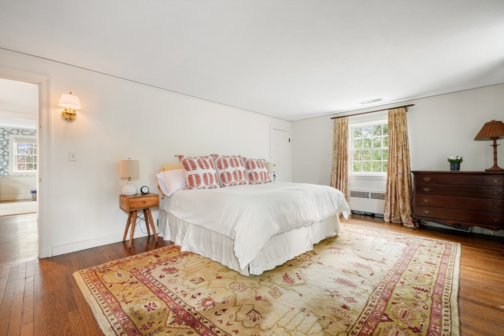 21 Alden Road Wellesley, MA 02481 - Photo 17 of 36 a bedroom with a bed and wooden floor