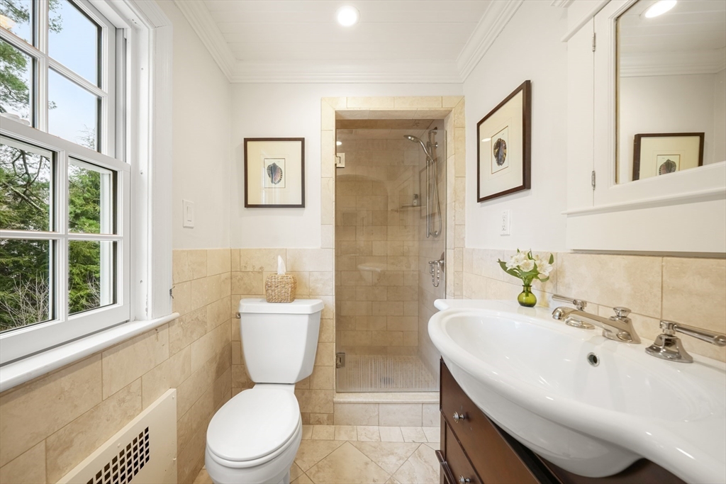 21 Alden Road Wellesley, MA 02481 - Photo 18 of 36 a bathroom with a sink mirror toilet and next to a window