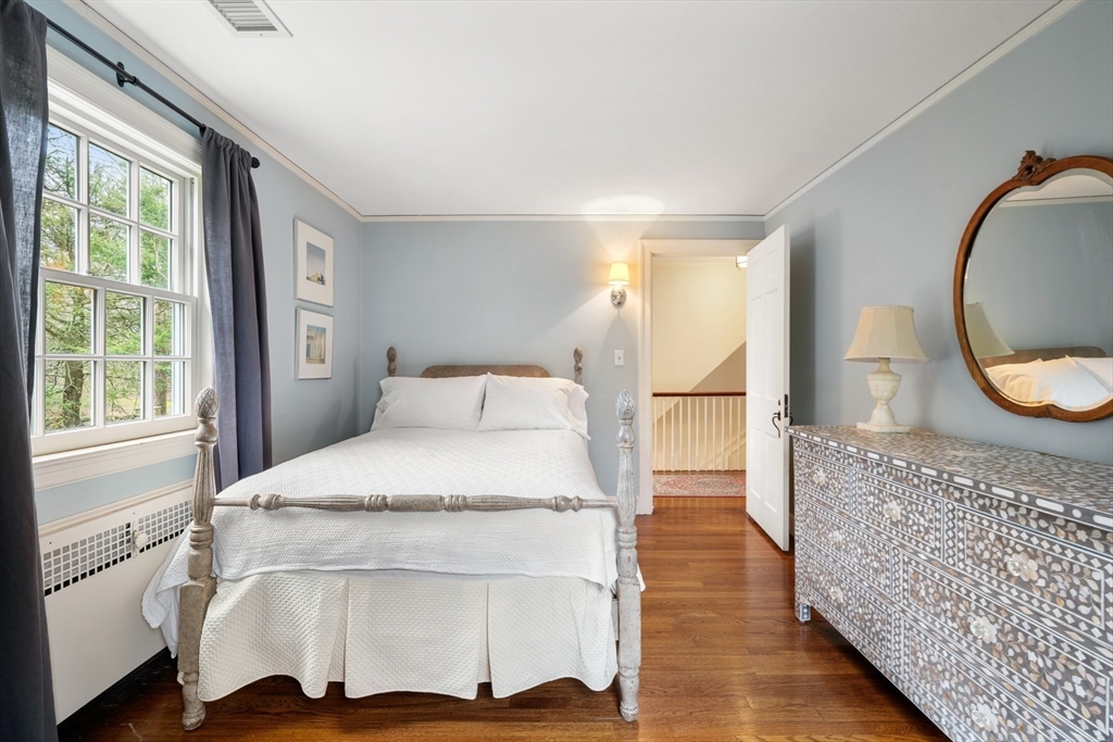 21 Alden Road Wellesley, MA 02481 - Photo 19 of 36 a en suite bathroom with a granite countertop double vanity mirror and a bathtub
