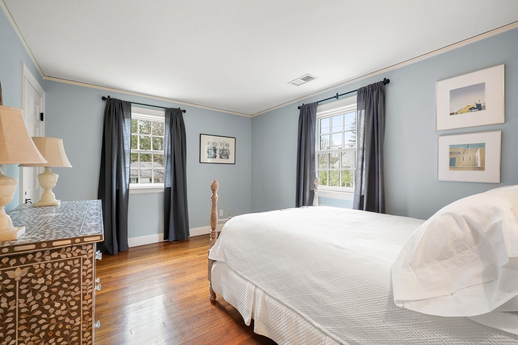 21 Alden Road Wellesley, MA 02481 - Photo 20 of 36 a bedroom with a bed and wooden floor