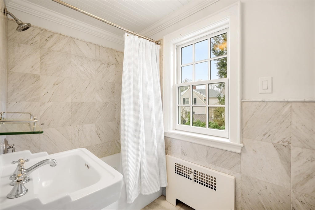 21 Alden Road Wellesley, MA 02481 - Photo 22 of 36 a bathroom with a bathtub and a sink