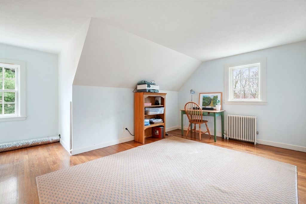 21 Alden Road Wellesley, MA 02481 - Photo 26 of 36 a room with furniture and a chair