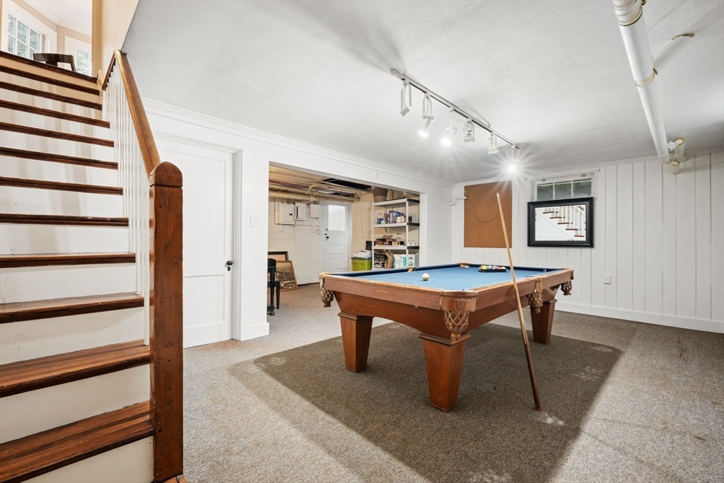 21 Alden Road Wellesley, MA 02481 - Photo 28 of 36 a room with furniture pool table wooden floor and windows