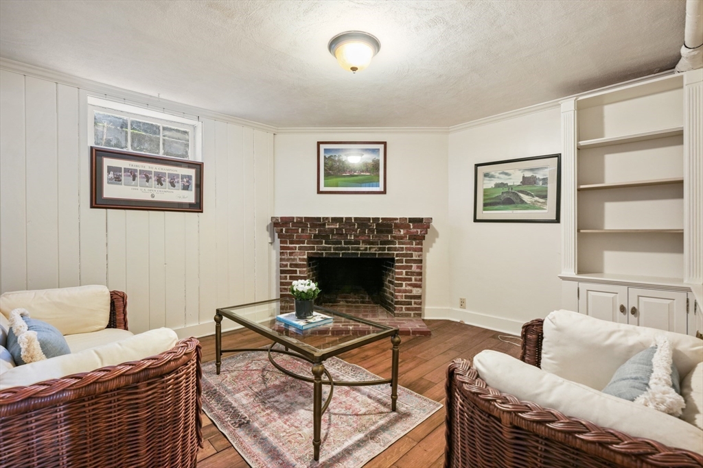 21 Alden Road Wellesley, MA 02481 - Photo 29 of 36 a living room with furniture and a fireplace