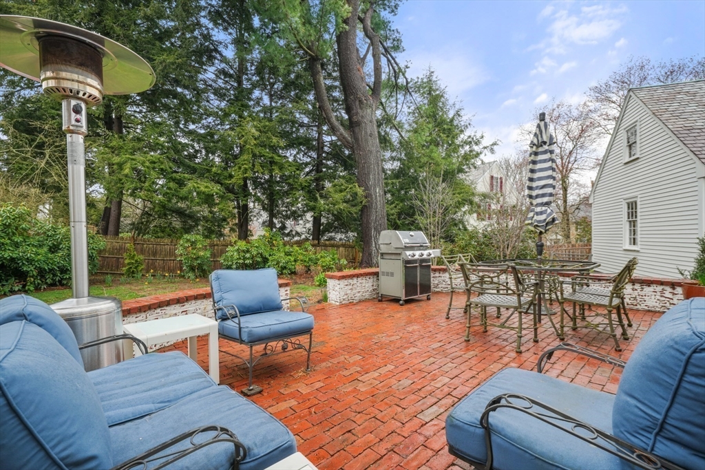 21 Alden Road Wellesley, MA 02481 - Photo 32 of 36 a view of a patio with couches table and chairs and potted plants