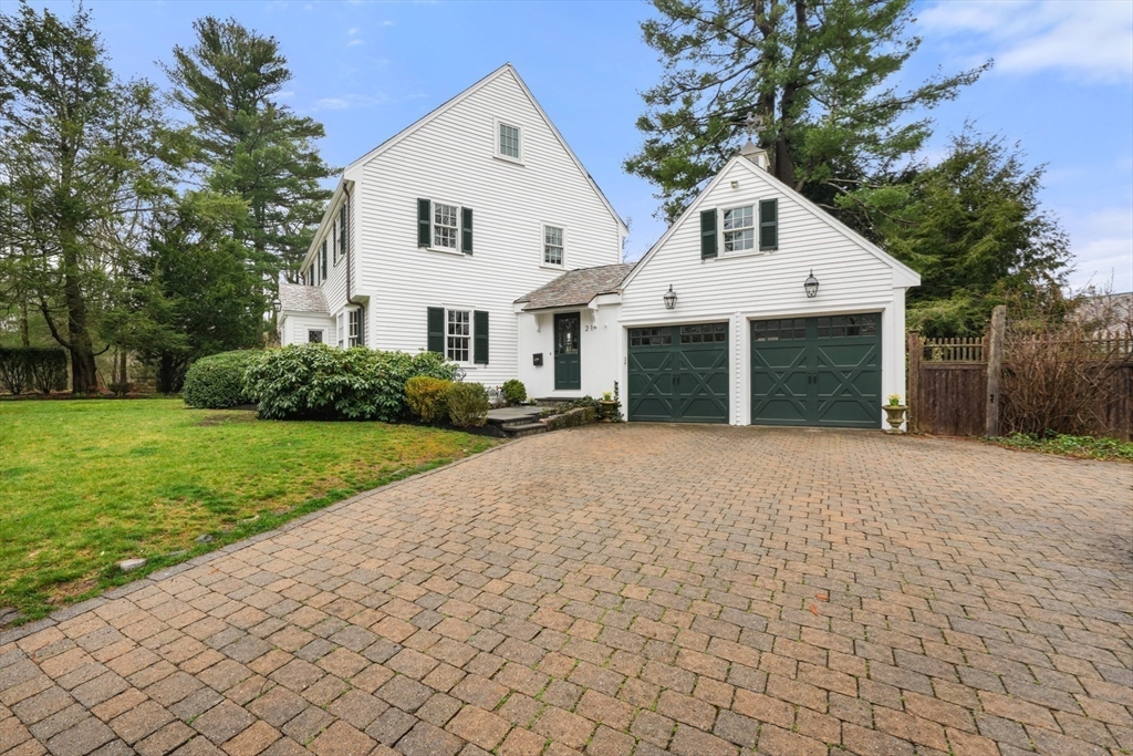 21 Alden Road Wellesley, MA 02481 - Photo 36 of 36 a front view of a house with a yard and garage