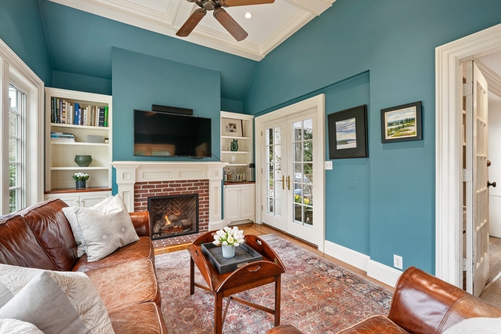 21 Alden Road Wellesley, MA 02481 - Photo 8 of 36 a living room with furniture a flat screen tv and a fireplace